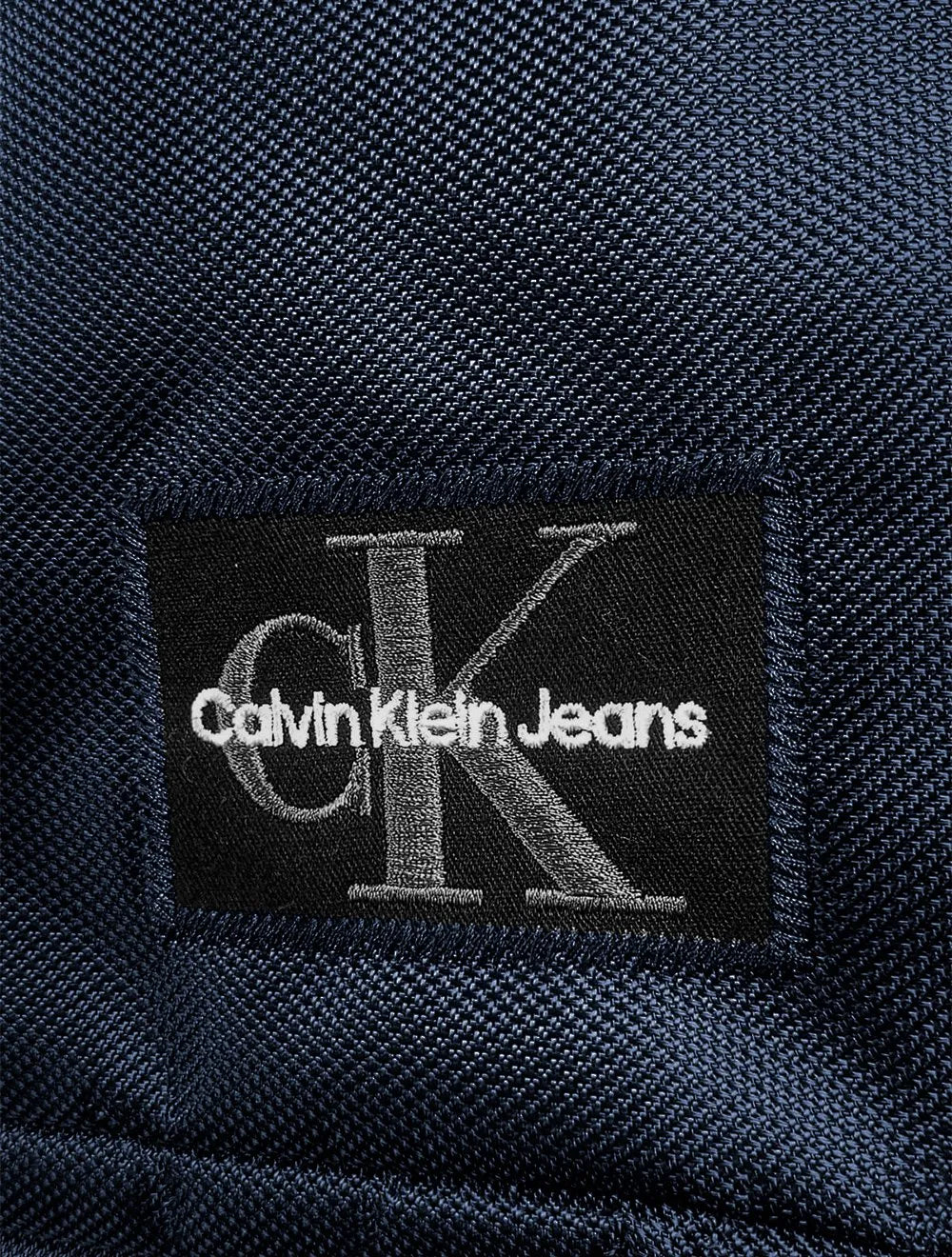 Mochila Calvin Klein Jeans Masculina Patch RE Issue Azul Marinho